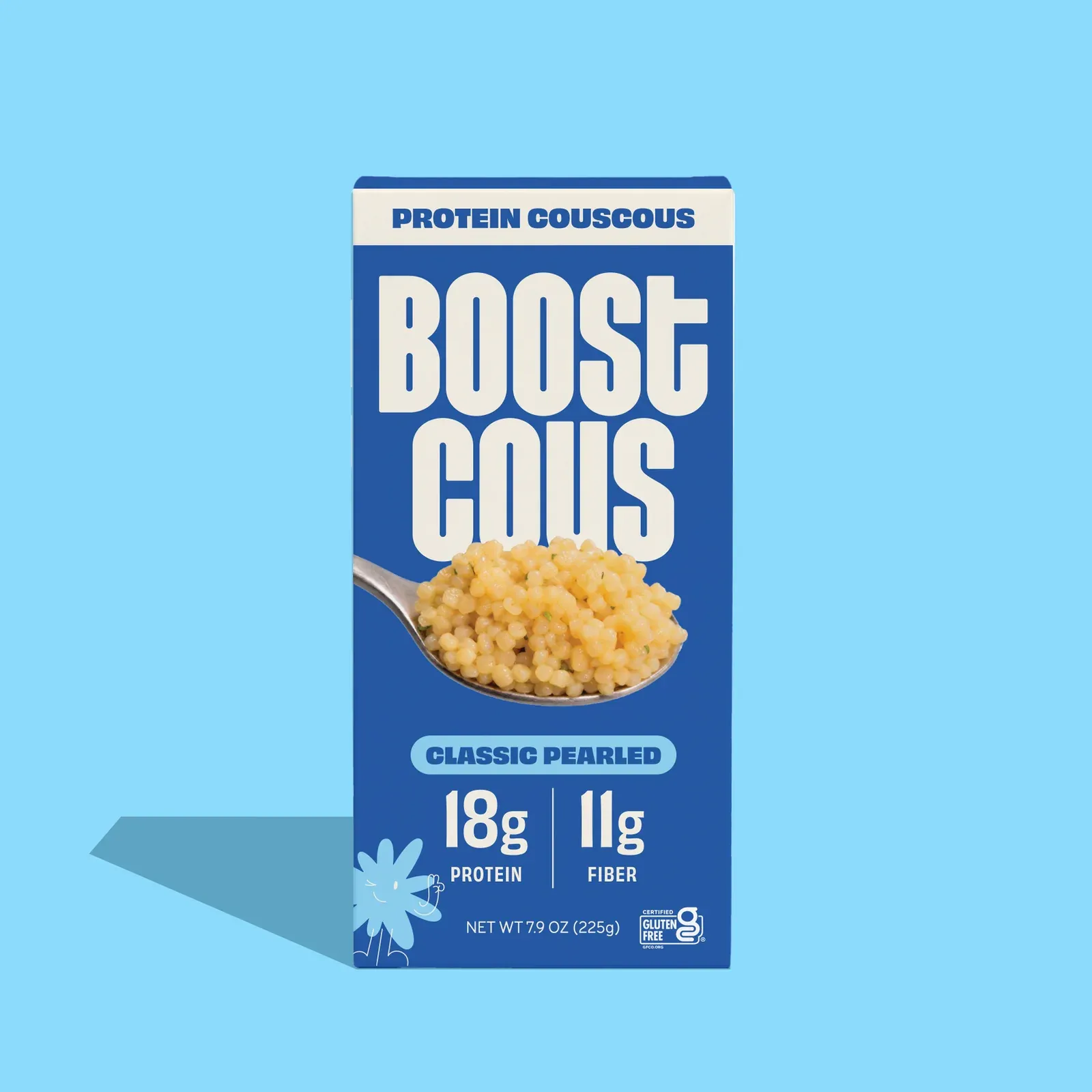 A box of Boostcous Classic Pearled protein couscous on a sky blue background